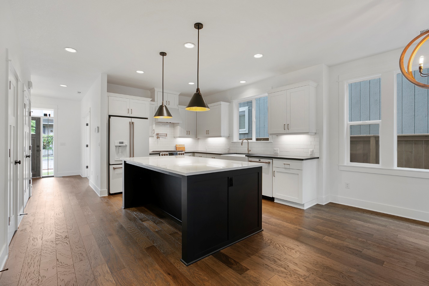 A kitchen with a large island Description automatically generated with low confidence