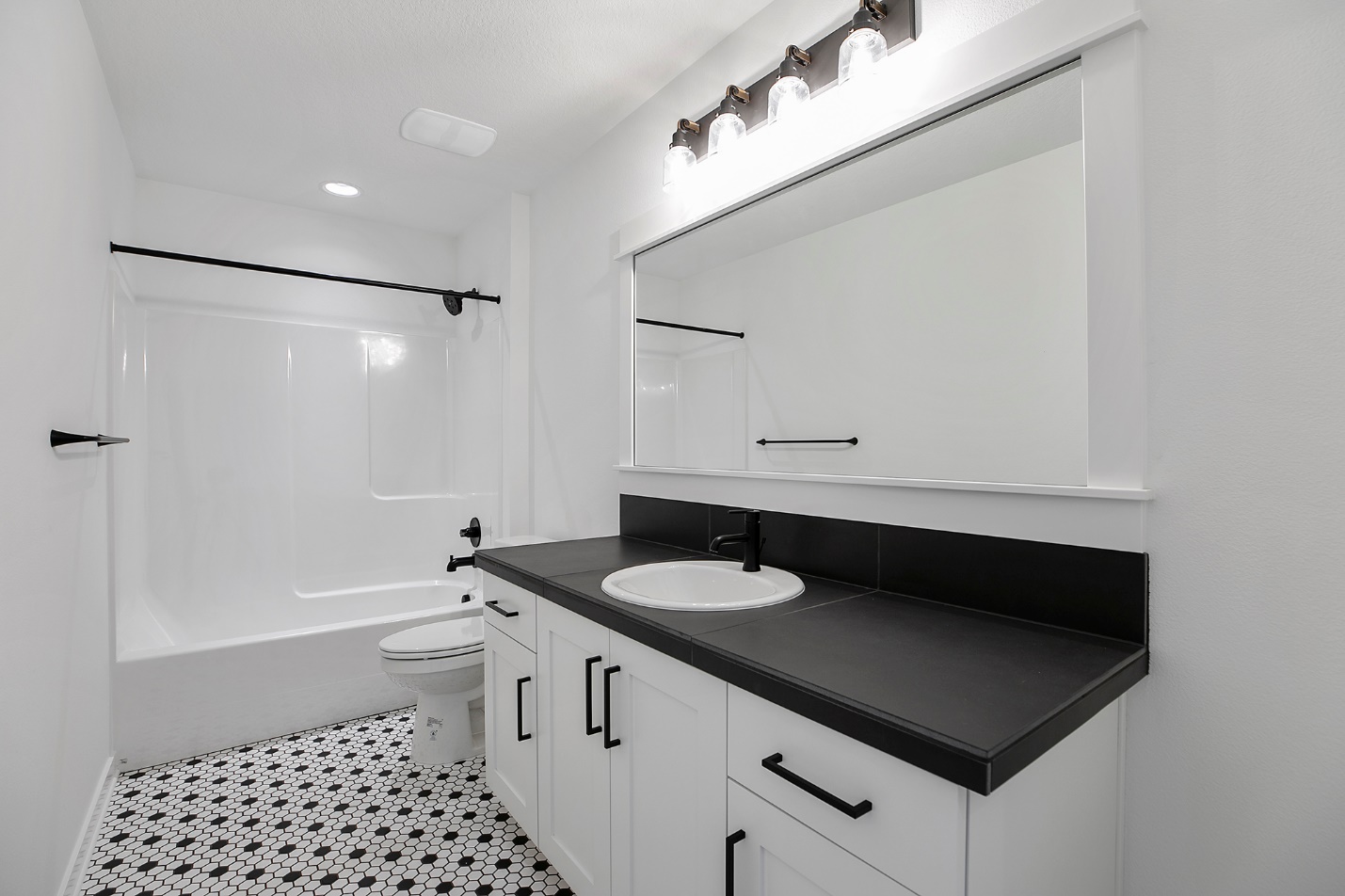 A picture containing indoor, wall, white, tile Description automatically generated